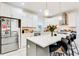 Modern kitchen featuring white cabinets, a center island with bar seating, and stainless steel appliances at 1506 Avon Sw Ave, Atlanta, GA 30311