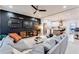 Spacious living room with a large gray sectional, media center, and dark accent wall, offering ample seating at 1506 Avon Sw Ave, Atlanta, GA 30311