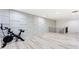 Spacious workout area features sleek hardwood floors, modern wall paneling and staircase access at 1506 Avon Sw Ave, Atlanta, GA 30311