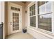 Covered outdoor balcony area, showcasing access to the interior and natural light from large windows at 3635 E Paces Ne Cir # 1308, Atlanta, GA 30326