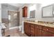 Bathroom boasts a large shower, double sinks, granite counters, and tiled floors at 3635 E Paces Ne Cir # 1308, Atlanta, GA 30326