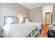 Comfortable bedroom features two twin beds, hardwood floors, and neutral decor for a restful ambiance at 3635 E Paces Ne Cir # 1308, Atlanta, GA 30326