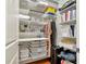 Organized walk-in closet featuring shelving, drawers, and hanging space for optimal storage solutions at 3635 E Paces Ne Cir # 1308, Atlanta, GA 30326