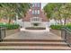 Grand entrance featuring brick steps and an elegant façade, framed by lush landscaping at 3635 E Paces Ne Cir # 1308, Atlanta, GA 30326