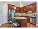 Kitchen with stainless steel appliances, a tile backsplash, and a granite countertop island at 3635 E Paces Ne Cir # 1308, Atlanta, GA 30326