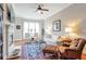 Bright living room features a fireplace, large windows, hardwood floors, and classic furnishings at 3635 E Paces Ne Cir # 1308, Atlanta, GA 30326