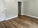 Bedroom featuring neutral walls, wood-look flooring, and white doors and trim at 3923 High Dove Sw Way # 16, Smyrna, GA 30082