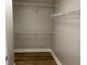 Walk-in closet featuring wire shelving and laminate flooring, maximizing storage space at 3923 High Dove Sw Way # 16, Smyrna, GA 30082