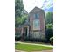 Charming brick townhome with stone accents and a manicured front yard at 3923 High Dove Sw Way # 16, Smyrna, GA 30082