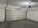 Spacious garage featuring an automatic door and ample room for parking and storage at 3923 High Dove Sw Way # 16, Smyrna, GA 30082