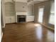 Inviting living room features a fireplace, built-in bookshelves, and hardwood floors at 3923 High Dove Sw Way # 16, Smyrna, GA 30082