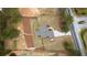 Aerial view of the property showing the layout, surrounding greenery, and a circular fire pit at 4025 Bullock Bridge Rd, Loganville, GA 30052