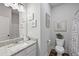 Bathroom with granite countertop and modern fixtures at 4025 Bullock Bridge Rd, Loganville, GA 30052