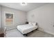 Calm bedroom featuring soft carpets, a cozy bed, and ample natural light at 4025 Bullock Bridge Rd, Loganville, GA 30052