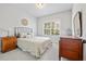 Neutral bedroom with cozy decor, soft lighting, and a large window view at 4025 Bullock Bridge Rd, Loganville, GA 30052
