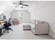 Versatile bonus room with neutral carpet, ceiling fan, and comfortable seating, perfect for relaxing or working at 4025 Bullock Bridge Rd, Loganville, GA 30052