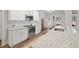 Modern kitchen with white cabinets, granite countertops, subway tile backsplash, and stainless steel appliances at 4025 Bullock Bridge Rd, Loganville, GA 30052