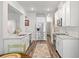 Charming kitchen featuring stainless steel appliances, granite countertops, and white cabinetry at 4025 Bullock Bridge Rd, Loganville, GA 30052