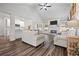 Cozy living room featuring a fireplace, comfortable seating, an open layout, and modern finishes at 4025 Bullock Bridge Rd, Loganville, GA 30052
