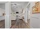 Spacious living room with high ceilings, a fireplace, wood-look floors, and an open floor plan at 4025 Bullock Bridge Rd, Loganville, GA 30052