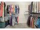 Spacious walk-in closet with ample hanging space and shelving for organized storage of clothing and accessories at 4025 Bullock Bridge Rd, Loganville, GA 30052