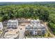 Aerial view of modern townhome community surrounded by lush green trees and nature at 1770 Beckham Ne Pl # 47, Atlanta, GA 30324