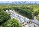Bird's-eye view of modern townhome community near the city surrounded by lush greenery at 1770 Beckham Ne Pl # 47, Atlanta, GA 30324