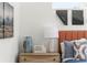 Close-up on stylish bedroom with modern decor, including a wood nightstand and orange headboard at 1770 Beckham Ne Pl # 47, Atlanta, GA 30324