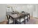 Open floor plan showing a dining room with a large wooden table and view of the kitchen at 1770 Beckham Ne Pl # 47, Atlanta, GA 30324