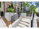 Stone staircase leading to a modern townhouse with black railings and manicured landscaping at 1770 Beckham Ne Pl # 47, Atlanta, GA 30324