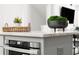 Close-up of kitchen island with stainless steel oven and decor at 1770 Beckham Ne Pl # 47, Atlanta, GA 30324