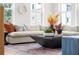 Bright living room features a comfortable couch, stylish rug, and large windows at 1770 Beckham Ne Pl # 47, Atlanta, GA 30324