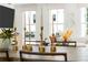 Bright living room with large windows featuring a comfortable sofa and stylish decor at 1770 Beckham Ne Pl # 47, Atlanta, GA 30324