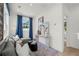 Living room with a large sectional sofa, neutral walls, blue curtains, and a modern art piece, creating a cozy space at 1770 Beckham Ne Pl # 47, Atlanta, GA 30324