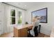 Bright home office with large windows, modern desk, and stylish decor for a comfortable workspace at 1770 Beckham Ne Pl # 47, Atlanta, GA 30324