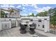 Stylish outdoor kitchen with grill, sink, and counter space adjacent to a dining set at 1770 Beckham Ne Pl # 47, Atlanta, GA 30324