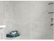 Elegant glass shower with marble-look tile, built-in shelves and a rain shower head at 1770 Beckham Ne Pl # 47, Atlanta, GA 30324