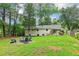 Private backyard featuring a fire pit and ample space for outdoor enjoyment at 679 Forest Ridge Se Dr, Marietta, GA 30067