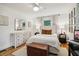 Charming bedroom showcasing stylish decor, wood floors, and comfortable furnishings at 679 Forest Ridge Se Dr, Marietta, GA 30067