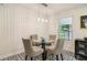 Charming dining area with black and white patterned floors, seating for four, and modern pendant lighting at 679 Forest Ridge Se Dr, Marietta, GA 30067