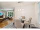 Cozy dining area adjacent to the living room boasts patterned tile floors, pendant lighting, and seating for four at 679 Forest Ridge Se Dr, Marietta, GA 30067
