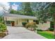 Inviting home with a long driveway, covered carport, and beautifully landscaped yard at 679 Forest Ridge Se Dr, Marietta, GA 30067