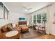 Inviting living room with ample seating, a stylish area rug, hardwood floors, and a large picture window at 679 Forest Ridge Se Dr, Marietta, GA 30067