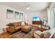 Comfortable living room features hardwood floors, stylish furnishings, and a large window for natural light at 679 Forest Ridge Se Dr, Marietta, GA 30067