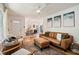 Bright living room featuring hardwood floors, contemporary furnishings, and an open concept design to the dining area at 679 Forest Ridge Se Dr, Marietta, GA 30067