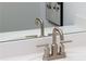 Close-up of a bathroom faucet featuring sleek design and modern fixtures at 1600 Driggs Nw Dr # 162, Atlanta, GA 30318