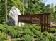 Entrance sign for Westside Park, showcasing a natural setting with lush greenery and towering trees at 1600 Driggs Nw Dr # 162, Atlanta, GA 30318