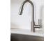 Close-up of a kitchen sink featuring a stainless steel faucet and white subway tile backsplash at 1600 Driggs Nw Dr # 162, Atlanta, GA 30318