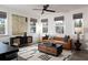 Bright living room with large windows, modern furniture, and stylish decor enhancing the inviting atmosphere at 1600 Driggs Nw Dr # 162, Atlanta, GA 30318