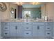 Modern bathroom with -and- sinks, granite counters, cabinets and a large mirror for a modern feel at 1867 Sterling Chase, Buford, GA 30518